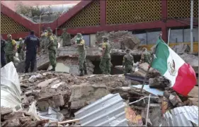  ??  ?? Soldiers remove debris from a partly collapsed municipal building felled by a massive earthquake in Juchitan, Oaxaca state, Mexico, on Friday. AP PHOTO/LUIS ALBERTO CRUZ