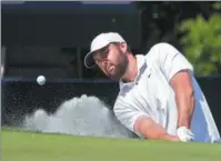  ?? AP ?? Scottie Scheffler hits out of a bunker en route to retaining his title at The Players Championsh­ip on March 17 in Florida.