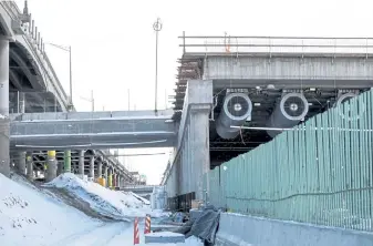  ?? AAron Ontiveroz, The Denver Post ?? Vintage Interstate 70, pictured on the left, overlooks the newly constructe­d underpass portion of the highway that is part of an ongoing expansion project.