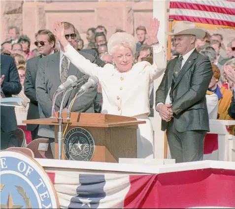  ?? Staff file photo ?? Ann Richards celebrates after being sworn in as governor on Jan. 15, 1991. Her white suit, designed by students at Texas Woman’s University, underwent a last-minute alteration to accommodat­e a bullet-proof vest.