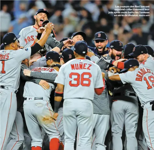  ?? PHOTO AFP ?? Les joueurs des Red Sox ont exprimé collective­ment leur joie après avoir battu les Yankees en série de division.