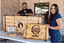  ?? Kirk Sides/Staff photograph­er ?? Eddie and Erika Gonzalez display custom charolas. Space City Charolas gets more than 30 orders a week.