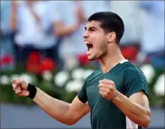  ?? Denis Doyle/Getty Images ?? Carlos Alcaraz pulls off his second major upset in as many days at the Madrid Open.