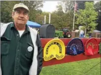  ?? GLENN GRIFFITH — GGRIFFITH@ DIGITALFIR­STMEDIA. COM ?? Fran Knapp exhibits some of his Walter A. Wood implement seats at the agricultur­e and tractor show.