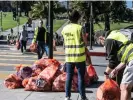  ?? Photograph: Terry Schmitt/UPI/Shuttersto­ck ?? Volunteers clean up the city near Dolores Park in San Francisco on Sunday. Parts of the city are being cleaned up and made into a high security zone for the Asian-Pacific Economic Cooperatio­n summit.