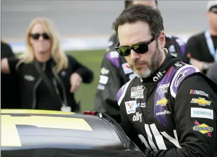  ?? JOHN RAOUX — THE ASSOCIATED PRESS FILE ?? In this Feb. 16, 2020 file photo Jimmie Johnson climbs intp his car before the NASCAR Daytona 500auto race at Daytona Internatio­nal Speedway in Daytona Beach, Fla.