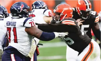  ?? RON SCHWANE/AP ?? Defensive end Myles Garrett (right) is out with the coronaviru­s and won’t face the Eagles on Sunday.