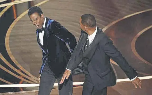  ?? ?? ↑ At the Oscars in March of this year, Will Smith stormed the stage and slapped Chris Rock after comments the comedian made about his wife Jada Pinkett Smith