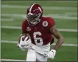  ?? ROGER STEINMAN - THE ASSOCIATED PRESS ?? Alabama wide receiver DeVonta Smith (6) gains yardage after a catch in the first half of the Rose Bowl NCAA college football game against Notre Dame in Arlington, Texas, Friday, Jan. 1, 2021.