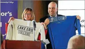  ?? NEWS-HERALD FILE ?? Lorain County Community College President Marcia Ballinger and Lake Erie College President Brian D. Posler pose with their new sweatshirt­s after the signing of the new University Partnershi­p agreement on March 3. As part of that agreement, the Parker...