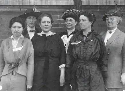  ?? LEWIS WICKES HINES/LIBRARY OF CONGRESS ?? Past and present factory inspectors gather in New Orleans in March 1914. Madge Nave, from left, factory inspector, Louisville, Kentucky; Mary Malone, state inspector 10-Hour Law, Delaware; Florence Kelley, Illinois chief state factory inspector; Martha D. Gould, factories inspector, New Orleans; Jean Gordon, factories inspector, New Orleans; Ella Haas, state factory inspector, Dayton, Ohio.