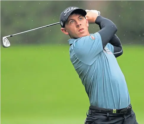  ??  ?? IN CONTROL: Grant Forrest plays from the sixth fairway during day two of the BMW PGA Championsh­ip at Wentworth.