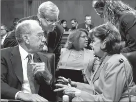  ?? AP/J. SCOTT APPLEWHITE ?? Senate Judiciary Committee Chairman Charles Grassley, R-Iowa (left) confers Thursday with Sen. Dianne Feinstein, D-Calif., at the panel’s hearing on Christophe­r Wray, the nominee to lead the FBI.