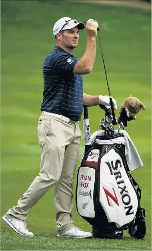  ?? — NZN ?? Ryan Fox selects a club on the ninth fairway during the first round of the Dubai Desert Classic at Emirates Golf Club yesterday.
The Kiwi has made the most of a late callup to the event, climbing into a share of eighth following a firstround...