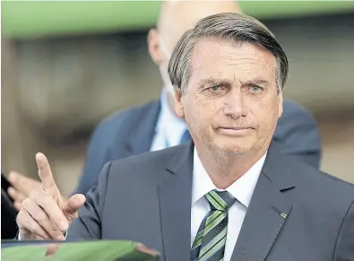  ?? Eraldo peres/ap ?? Bolsonaro saliendo ayer de la jura del nuevo ministro de la Corte Suprema