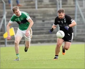  ??  ?? Bray’s Dara Ó Hannaidh keeps a close eye on Newtown’s Barry Davis during the JBFC semi-final.