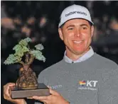  ?? AP PHOTO/DENIS POROY ?? Luke List holds up the championsh­ip trophy after winning the PGA Tour’s Farmers Insurance Open on Saturday in San Diego.