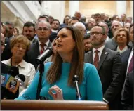  ?? (Arkansas Democrat-Gazette/Stephen Swofford) ?? Lawmakers, students, parents and teachers gather around Gov. Sarah Huckabee Sanders as she announces her education plan Wednesday at the state Capitol.