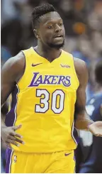  ?? AP PHOTO ?? MONSTER DAY: Julius Randle celebrates after scoring two of his 23 points during the Los Angeles Lakers’ win against the Mavericks yesterday in Dallas.