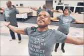  ??  ?? MICHAEL PETERS, 51, does tai chi as part of the project at Holman United Methodist Church.