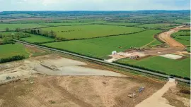  ??  ?? A view of the Leighton Buzzard Eastern Link Road under constructi­on with the diverted line in the foreground. JOE TOLEY