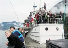  ??  ?? Passengers onboard the MV Uchuck III scan the water and sky looking for whales, sea lions and bald eagles.