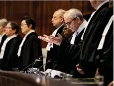  ?? AFP ?? ICJ chief Nawaf Salam, right, during yesterday’s hearing into the legality of Israel’s occupation of Palestinia­n territorie­s