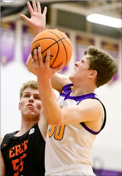  ?? ?? Boulder’s Riley Stein, right, puts up a shot over Erie’s Jett Hinze during their game Tuesday night in Boulder. MATTHEW JONAS — STAFF PHOTOGRAPH­ER