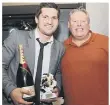  ??  ?? LOVELY BUBBLY Steve Ramsey with Hawks vice president James Fallon after winning the players’ player of the year award at the end of the 2011/12 season