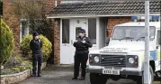  ?? FRANK AUGSTEIN / ASSOCIATED PRESS ?? Police stand outside the house of former Russian double agent Sergei Skripal in Salisbury, England, earlier this month after, authoritie­s say, Skripal and his daughter came into contact with a military-grade nerve agent at their front door.