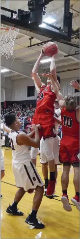  ??  ?? Blackhawk junior Wes Wales (No. 23) jumped for a shot Friday night in the contest against the Gentry Pioneers. Wales led the scoring with 19 points Friday.