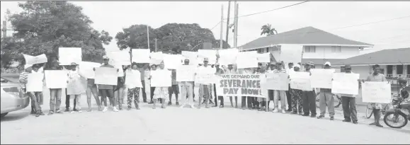  ??  ?? Some of the protesting ex-workers yesterday