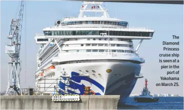  ?? KAZUHIRO NOGI/AFP VIA GETTY IMAGES ?? The Diamond Princess cruise ship is seen at a pier in the port of Yokohama on March 25.