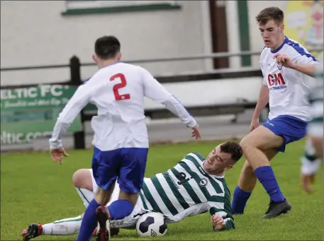  ??  ?? Eoin Nicholson in action for Strand Celtic at home to Merville. Pics: Carl Brennan.