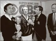  ??  ?? Brent Musberger (center) voiced his last game for ESPN on Jan. 31.