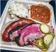  ??  ?? Matt’s BBQ serves authentic brisket and sausage.