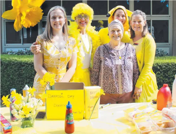  ??  ?? Erin Woods, Michelle Alchin, Deb Reid, Rachel Vickers and Traci Hayman all get into the colourful spirit for the Palm Beach Currumbin High’s Daffodil Day fundraiser.