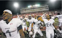  ?? CHASE STEVENS/LAS VEGAS REVIEW-JOURNAL VIA AP ?? Howard players celebrate Saturday after defeating UNLV 43-40 at Sam Boyd Stadium in Las Vegas, Nev.