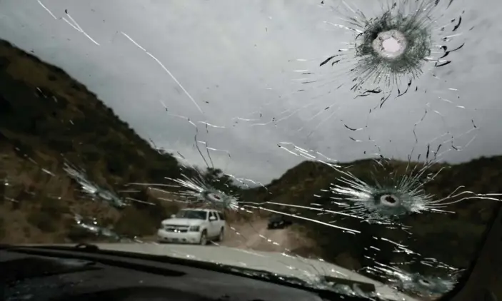  ?? Photograph: Christian Chavez/AP ?? Bullet-riddled vehicles that members of the extended LeBarón family were travelling in sit parked on a dirt road near Bavispe, at the Sonora-Chihuahua state border, Mexico, on Wednesday.