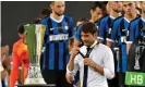  ??  ?? Antonio Conte removes his runners-up medal as he walks past the trophy. Photograph: Reuters