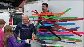  ?? EVAN BRANDT — MEDIANEWS GROUP ?? Pottstown Borough Council President Dan Weand, left, was among those who helped tape state Rep. Joe Ciresi to a trailer Saturday at the Pottstown Children’s Discovery Center.