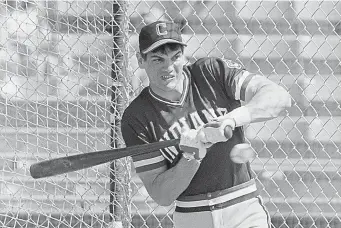  ?? AP Photo/Sal Veder, Fle ?? ■ In this March 5, 1982, file photo, Cleveland Indians left fielder Joe Charboneau gets jammed in the batting cage at Cleveland's spring training camp in Tucson, Ariz. The charismati­c Charboneau arrived on the scene as that promising prospect who was the life of the party. His tales were epic off the field — opened beer bottles with his forearm or his eye socket (just once or twice, he cautioned). Once fixed a broken nose with pliers. Stitched up a cut with fishing line. Charboneau sees a little bit of himself in the iconic baseball film “The Natural,” that finished tied for No. 8 in The Associated Press Top 25 favorite sports movies poll.