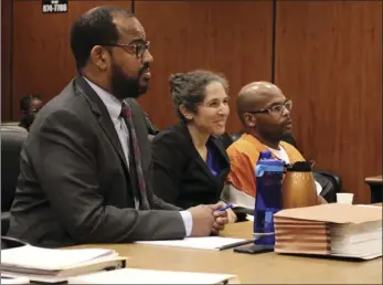  ?? LORI REINAUER/NORTHERN CALIFORNIA INNOCENCE PROJECT VIA AP ?? This photo provided by the Northern California Innocence Project shows Zavion Johnson (right), with members of his legal team in court in Sacramento on Friday.