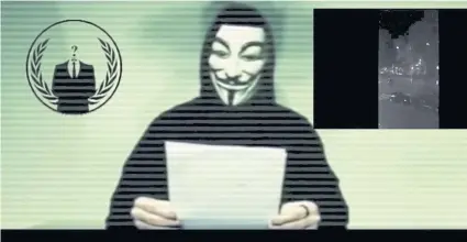  ?? REUTERS ?? A man wearing a mask associated with Anonymous says the group is preparing to unleash waves of cyberattac­ks on Islamic State following the attacks in Paris last week that killed 129 people.