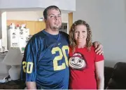  ?? CONTRIBUTE­D ?? Brent Dalton of Middletown roots for Michigan. His wife, Kelly, likes OSU. “She’ll watch (the big game) in one room, and I’ll watch separate from her,” he said.