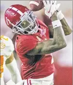  ?? AP ?? QUITE THE CATCH: Jameson Williams, who got little chance to play in two seasons at Ohio State, has 51 catches for 1,081 yards and 10 TDs in a breakout season for Alabama.