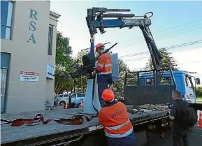  ?? KERRY KAY/SUPPLIED ?? Babcock NZ remove East Coast Bays RSA’s Oerlikon gun, which is to be refurbishe­d by the navy before it finds a new home.