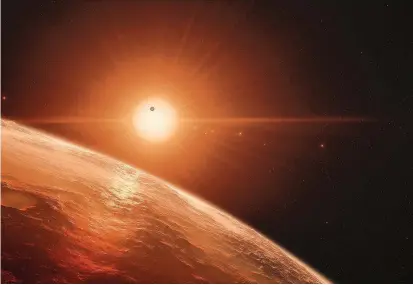  ?? FOTO ?? Hasta ahora no se conoce un solo sitio con vida fuera de la Tierra. Acá, dibujo del sistema de planetas Trappist-1 a 40 años luz, donde hay varios planetas que podrían tener agua.