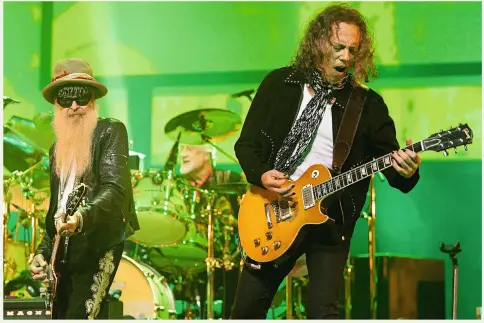  ??  ?? Performing at the London Palladium on 25 February this year (L-R): Billy Gibbons, Mick Fleetwood and Kirk Hammett (and Greeny!)