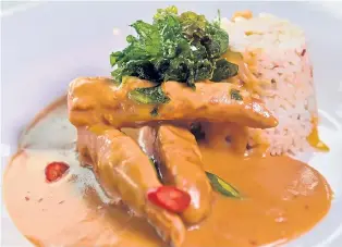  ??  ?? Chicken satay with peanut satay sauce, vegetable rice, chillies and crispy kale